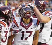  ??  ?? Virginia Tech QB Josh Jackson celebrates after a touchdown run in the Camping World Bowl. Jackson’s two TD runs weren’t enough against Oklahoma State.