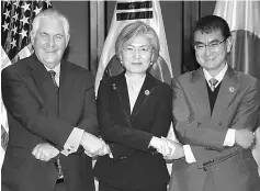 ?? — AFP photo ?? (From left) Tillerson, South Korean Foreign Minister Kang Kyung-Wha and Japan’s Foreign Minister Taro Kono pose for a photo during their trilateral meeting on the sidelines of the Asean regional security forum.