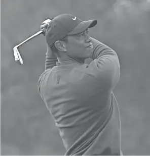  ?? MICHAEL MADRID/USA TODAY SPORTS ?? Tiger Woods hits from the third tee during the final round of the Masters on Sunday in Augusta, Ga.