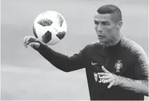  ?? AP Photo/Armando Franca ?? TRAINING. Portugal's Cristiano Ronaldo controls the ball, during a team training session, in Oeiras, outside Lisbon, Monday, June 4 2018.
