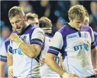  ?? Pictures: SNS Group. ?? Far left: Huw Jones celebrates Scotland’s second try with Tommy Seymour; left: Stuart Hogg is brought down by Beauden Barrett in the dying seconds; top: Hogg is almost inconsolab­le as he contemplat­es what could have been; above: dejected Scotland...