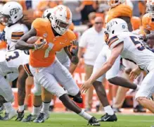  ?? STAFF PHOTO BY ROBIN RUDD ?? Tennessee’s Marquez Callaway (1) eludes a Texas-El Paso Miner defender last September at Neyland Stadium.