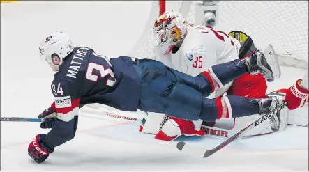  ?? — THE ASSOCIATED PRESS ?? American Auston Matthews attacks the net of Belarus goalkeeper Kevin Lalande during a preliminar­y round contest at the World Hockey Championsh­ip in Russia on Saturday.