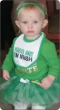  ??  ?? 14-month Kayleigh Erin of Holland celebrates St. Patrick’s Day with a French fry at the Green Parrot in Newtown.