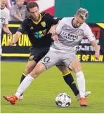  ?? ADOLPHE PIERRE-LOUIS/JOURNAL ?? New Mexico United’s Toni Soler, left, and Sacramento Republic’s Vilyan Bijev battle for possession during a game last month.