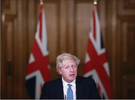  ?? HANNAH MCKAY — POOL PHOTO VIA AP, FILE ?? In this Jan. 5, 2021, file photo, Britain’s Prime Minister Boris Johnson speaks during a news conference inside 10 Downing Street in London. World leaders, including Johnson, are condemning the storming of the U.S. Capitol by supporters of President Donald Trump.