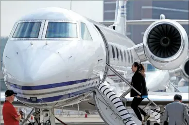  ?? ZHANG JINGJIA / XINHUA ?? Visitors at the fourth Macao Business Aviation Expo check out a small jet on display. Participat­ing makers of business jets from the US, France, Brazil said they received numerous enquires from potential buyers in China.