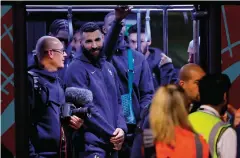  ?? — afp ?? France forward Karim Benzema (centre) with the team at the Hamad Internatio­nal Airport in Doha on Wednesday.