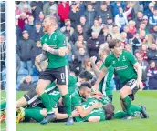  ?? — AFP ?? Lincoln City’s Sean Raggett (centre) celebrates with teammates after scoring against Burnley in their FA Cup fifth round match at the Sincil Bank Stadium in Lincoln on Saturday. The hosts won 1-0.