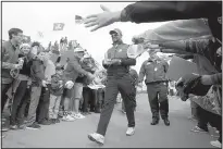  ?? CHARLIE RIEDEL/ASSOCIATED PRESS ?? Tiger Woods walks to the eighth hole during a practice round at Hazeltine National Golf Club. Woods seems to be taking seriously his role as non-playing assistant captain for the U.S. team.