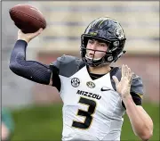  ?? AP file photo ?? Drew Lock, who passed for 3,944 yards and an SEC-record 44 touchdowns for Missouri last season, considered entering the NFL Draft but opted to return for his senior season.