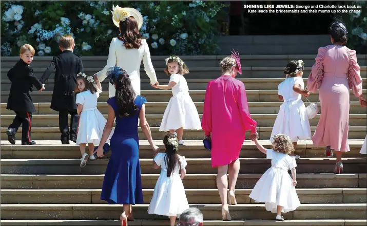  ??  ?? George and Charlotte look back as Kate leads the bridesmaid­s and their mums up to the chapel SHINING LIKE JEWELS: