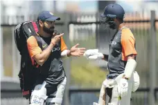  ?? Getty ?? India captain Vitat Kohli, left, chats with Cheteshwar Pujara during yesterday’s training session in Perth