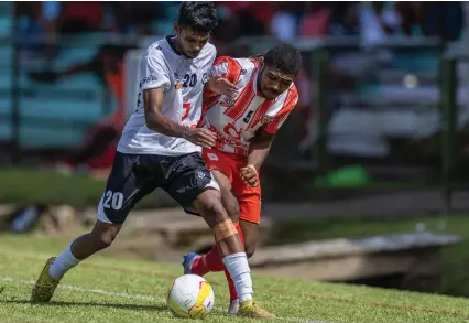  ?? Photo: Leon Lord ?? Suva’s Faizal Ali (left) tries to escape from Labasa’s Nemani Dolodai during their Digicel Fiji Premier League match at Ratu Cakobau Park, Nausori on March 3, 2024.