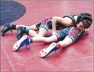  ?? Randy Moll/Westside Eagle Observer ?? Clayton Smith attempts to pin his opponent during a GYO wrestling match in Carl Gym on Saturday.