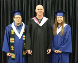  ??  ?? SUEANN MUSICK/THE NEWS Hayden MacIvor, left, and Shawna Francis, award winners during NNEC graduation ceremony, spend some moments with retiring vice-principal John van Vulpen.