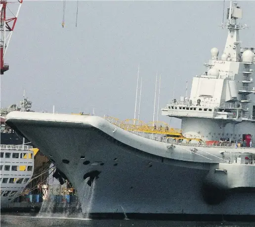  ?? AFP / Gett y Imag es ?? China’s first aircraft carrier, the former Soviet carrier Varyag, which China bought from Ukraine in 1998.