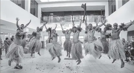  ?? AFP ?? Traditiona­l dancers in grass skirts welcome holidaymak­ers in Nadi on Wednesday as Fiji opens its borders to internatio­nal travellers for the first time since the Covid-19 pandemic swept the globe and devastated its tourism-reliant economy.