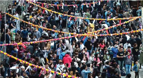  ??  ?? People taking part in a Lunar New Year fair organised by pro-democracy district councillor­s in the Sai Ying Pun district in Hong Kong.