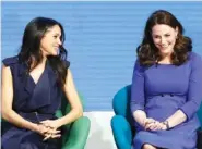  ?? THE ASSOCIATED PRESS ?? Meghan Markle, left, and Kate, Duchess of Cambridge laugh Wednesday during the first annual Royal Foundation Forum in London. Under the theme “Making a Difference Together,” the event will showcase the programs run or initiated by The Royal Foundation.