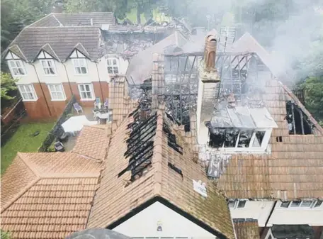  ??  ?? Extensive damage to the roof of Croft Care Home from where residents were evacuated.