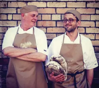  ?? DONAL SKEHAN ?? Peter Flynn, left, and Vlad Rainis operate a bakery together in Dublin. They’re also life partners who will be voting in favour of legalizing gay marriage in the country’s referendum on Friday.