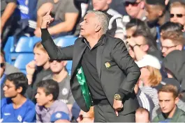  ?? — AFP photo ?? Manchester United’s Portuguese manager Jose Mourinho gestures on the touchline during the English Premier League football match between Chelsea and Manchester United at Stamford Bridge in London on October 20, 2018.