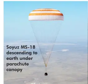  ??  ?? Soyuz MS-18 descending to earth under parachute canopy