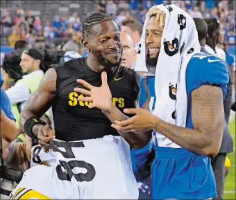  ?? BILL KOSTROUN/AP PHOTO ?? Giants wide receiver Odell Beckham, right, talks with Pittsburgh wide receiver Antonio Brown after a preseason game on Aug. 11 at MetLife Stadium.