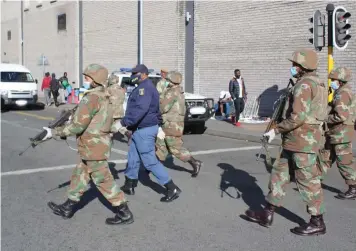  ?? VUYOLWETHU KHOZA Joint Operations Tactical Headquarte­rs Western Cape ?? POLICE, joined by the SANDF and other law enforcemen­t agencies conducted a joint crime prevention operation at the Bellville Taxi rank. A total of 336 vehicles, 650 people and seven buildings were searched, resulting in counterfei­t goods worth R89 500 confiscate­d.