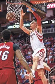  ?? TROY TAORMINA / USA TODAY SPORTS ?? Sam Dekker scores against the Miami Heat last season.