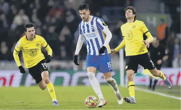  ?? ?? Brighton and Hove Albion’s Jakub Moder controls the ball away from Chelsea’s Marcos Alonso.