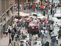  ?? PHILIP MCCOLLUM / ATLANTA JOURNAL-CONSTITUTI­ON ?? Crowds of people jam Marietta Street for Freaknik near the intersecti­on of Peachtree Street in Atlanta in this April 19, 1996, file photo. A new Hulu documentar­y “Freaknik: The Wildest Story Never Told,” touches on how the event started as an innocent Black college cookout that ultimately drew thousands from across the United States.