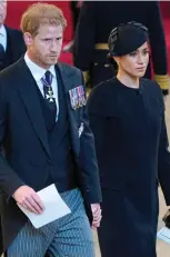  ?? ?? In mourning: Harry and Meghan