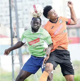  ?? FILE ?? Romaine Brackenrid­ge (right), then of Tivoli Gardens, and Montego Bay United’s Dino Williams battle for possession of the ball during their Red Stripe Premier League football match at the Edward Seaga Complex on Sunday, February 25, 2018.