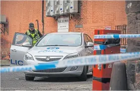  ?? ?? Police investigat­e as a cordon is put up at the back of the nightclub.