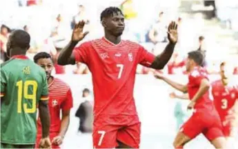  ?? ?? Switzerlan­d’s Breel Embolo refuses to celebrate, but acknowledg­es plaudits after scoring the winning goal against Cameroun… yesterday.