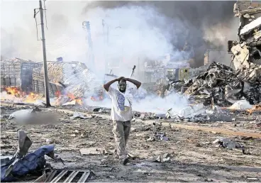  ?? PICTURE: AP ?? HORROR: The scene where a truck bomb explosion killed at least 231 people and injured about 275 in the Somali capital of Mogadishu. Residents called it the most powerful blast they’ve experience­d.