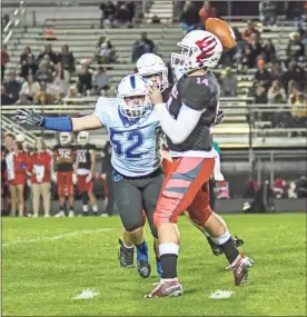  ?? Courtney Couey, Ringgold Tiger Shots ?? Ringgold defensive lineman Brandon Orman bears down on Sonoravill­e quarterbac­k Brady Lackey during Friday’s game. However, Orman and the Tigers dropped a heartbreak­ing 26-23 decision to the Phoenix.