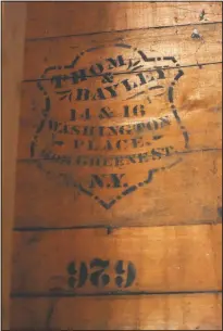  ??  ?? The Kolfages found this “Thom & Bayley” company logo that was upside-down under the cedar lapping on the original outer walls during renovation work. “We found stenciling on the boards (in the walls) they said. It was for a hat maker in New York City. The address on it still exists in lower Manhattan.”