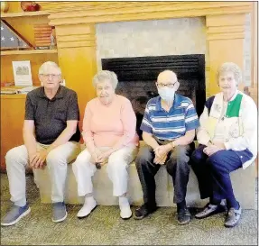  ?? Lynn Atkins/The Weekly Vista ?? Steve Larsen, Plaza board president, poses with longterm residents: Mickey Victor, Charles Whiteford and Evelyn MacLean in the lobby of The Plaza. The lobby, they agreed, is a meeting place for the residents of the state’s largest co-op.