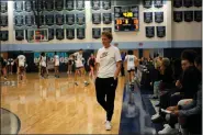  ?? JOHN LOCHER — THE ASSOCIATED PRESS ?? Centennial High School girls basketball coach Karen Weitz stands on the court during a break in play in a game Jan. 24 in Las Vegas. Weitz coaches both the boys and girls basketball teams at the school.