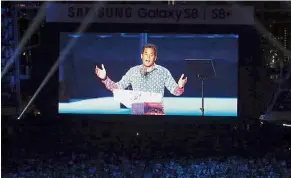  ??  ?? On screen: Khairy delivering his speech during the opening ceremony of the Games.