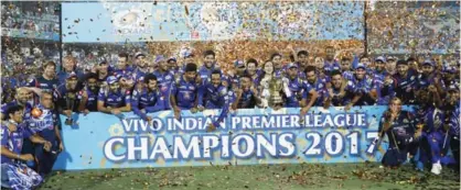  ??  ?? HYDERABAD, India: Mumbai Indians pose with trophy after winning the Indian Premier League (IPL) cricket final match against Rising Pune Supergiant yesterday. — AP