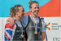  ?? STEVE MCARTHUR/ROWING NZ ?? Olivia Loe and Brooke Donoghue smile after receiving their women’s double sculls gold medal at the world rowing champs in Florida, US.