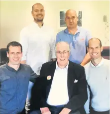  ??  ?? Family gathering John at his 100th birthday party with grandsons (back row, left) Matthew and John and (front, row, left) Alastair and Andrew