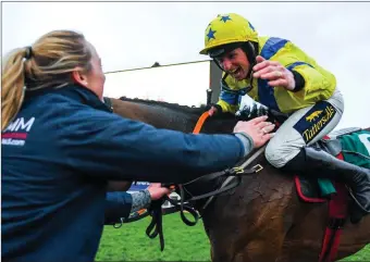  ??  ?? Jamie Codd is congratula­ted after his win with Ravenhill at last year’s Cheltenham Festival.