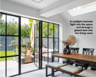  ??  ?? A ROOFLIGHT CHANNELS LIGHT INTO THE SPACE AND THROUGH A GLAZED DOOR INTO THE LIVING ROOM