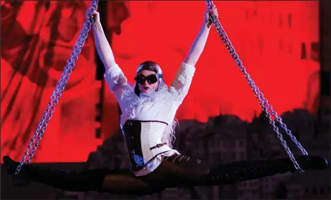  ??  ?? Lauren Jamieson of Spinal Chord climbs chains in the Linthouse, a former shipyard building at the Scottish Maritime Museum in Irvine, Ayrshire, as she rehearses for the Light, Fire & Aerial Art Spectacula­r, a highlight of the four day illuminati­on:...