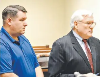  ?? Larry Hardy, Orangeburg (S.C.) Times and Democrat ?? Richard Combs, left, the former police chief in the town of Eutawville, S.C., appears in court Thursday with his attorney, John O’Leary.